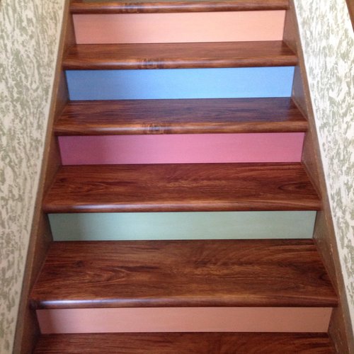 LVP flooring on stairs in a McFarland, WI home by Bisbee's Flooring Center