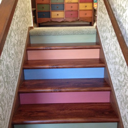 LVP flooring on stairs in a McFarland, WI home by Bisbee's Flooring Center