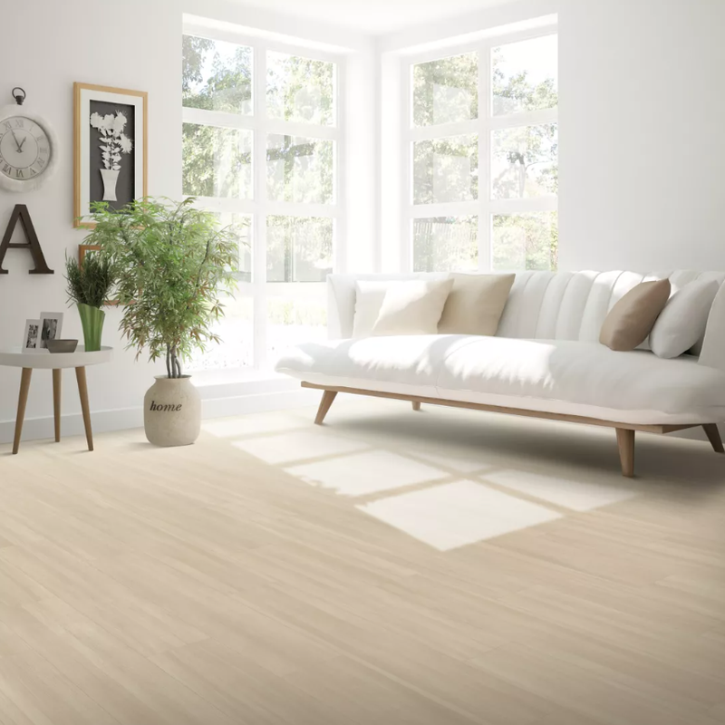 Bright room with a white sofa and vinyl UltimateFlex floors