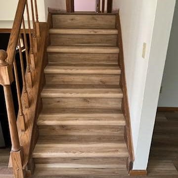 LVP stairs in a McFarland, WI home by Bisbee's Flooring Center