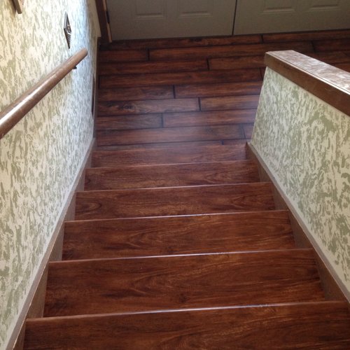 LVP stairs in a McFarland, WI home by Bisbee's Flooring Center