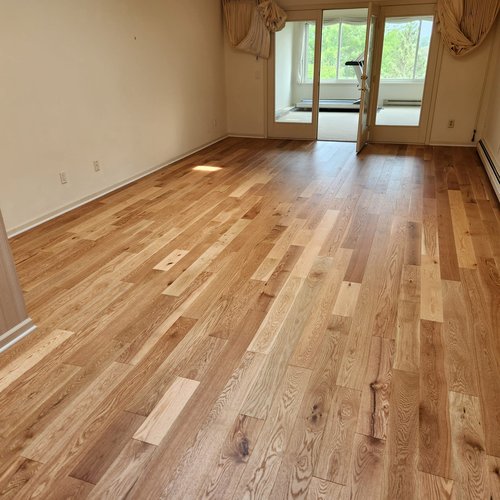 Wood flooring in a McFarland, WI dining room by Bisbee's Flooring Center