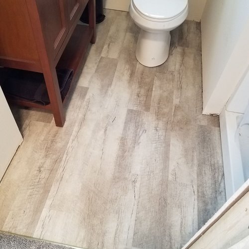 Luxury Vinyl floors in a McFarland, WI bathroom by Bisbee's Flooring Center