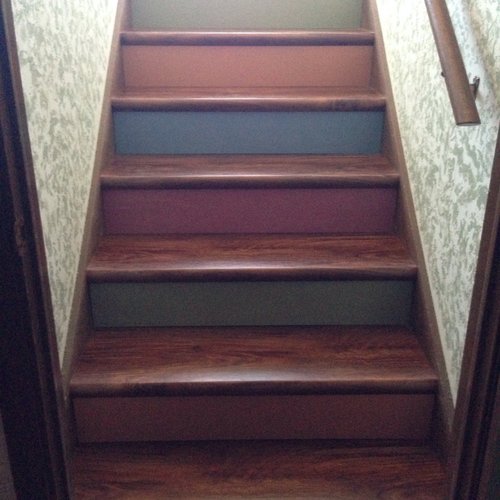 LVP flooring on stairs in a McFarland, WI home by Bisbee's Flooring Center