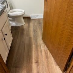 Luxury Vinyl plank floors in a McFarland, WI bathroom by Bisbee's Flooring Center